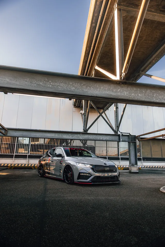 The Octavia RS framed by steel beams and overhead lighting