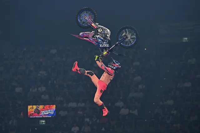 ZAPSA performing an aerial freestyle motocross trick above an arena crowd
